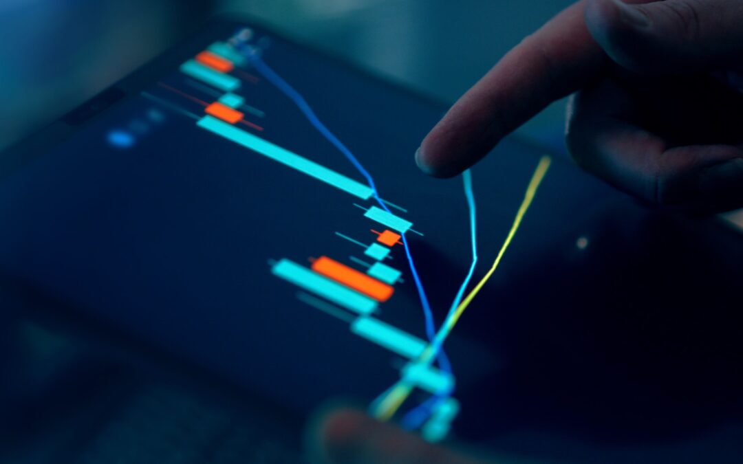 Close-up of a finger interacting with a digital chart on a tablet, depicting financial data and analysis.